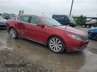 2013 Lincoln MKS EcoBoost with VIN 1LNHL9FTXDG606799, listed as a Copart auction lot 57469995 with 80,168 mi miles and Salvage title. Bid and sale history available at DreamBid. Image 4.