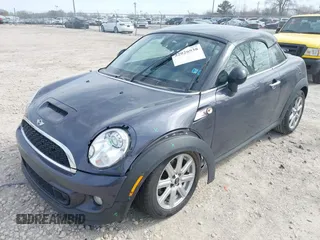 2013 MINI Coupe S with VIN WMWSX3C50DT466882, listed as a IAAI auction lot 42026938 with 99,499 mi miles and . Bid and sale history available at DreamBid. Image 2.