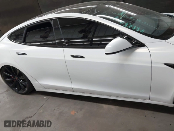 2017 Tesla Model S 100D z VIN 5YJSA1E2XHF224671, wystawiony jako IAAI lot #42665581 z przebiegiem 128 517 mil mil oraz . Historia ofert i sprzedaży dostępna na DreamBid. Obrazek 13.