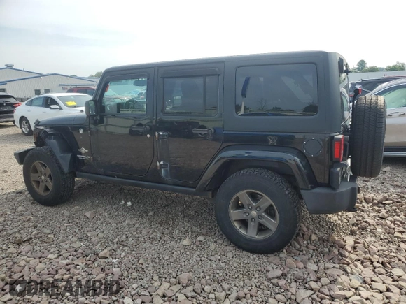2015 Jeep Wrangler Unlimited Freedom with VIN 1C4BJWDG4FL568601, listed as a Copart auction lot 64041415 with 128,874 mi miles and Salvage title. Bid and sale history available at DreamBid. Image 2.