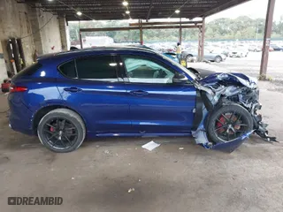 2021 Alfa Romeo Stelvio Ti with VIN ZASPAKBN4M7D21284, listed as a IAAI auction lot 40573443 with 26,230 mi miles. Bid and sale history available at carsss.com. Image 13.