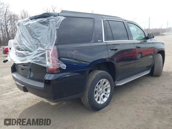 2015 GMC Yukon SLT z VIN 1GKS1BKCXFR192349, wystawiony jako IAAI lot #41842474 z przebiegiem 185 166 mil mil oraz . Historia ofert i sprzedaży dostępna na DreamBid. Obrazek 4.