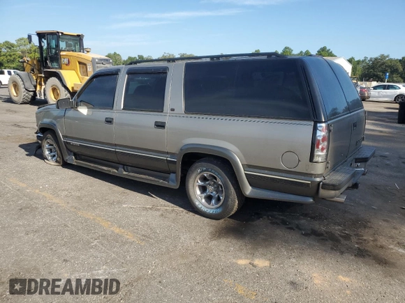 1999 Chevrolet Suburban with VIN 1GNEC16R9XJ490863, listed as a Copart auction lot 65938594 with 176,391 mi miles and Salvage Title. Bid and sale history available at carsss.com. Image 2.
