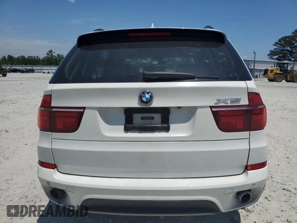 2012 BMW X5 35i z VIN 5UXZV4C54CL990840, wystawiony jako Copart lot #57715245 z przebiegiem 166 192 mil mil oraz Szkoda całkowita • Salvage title. Historia ofert i sprzedaży dostępna na DreamBid. Obrazek 6.