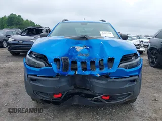2019 Jeep Cherokee Trailhawk with VIN 1C4PJMBX0KD141577, listed as a IAAI auction lot 42413454 with 122,386 mi miles and . Bid and sale history available at DreamBid. Image 12.
