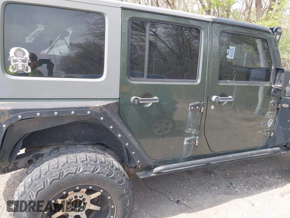 2007 Jeep Wrangler Unlimited X with VIN 1J4GA39147L101084, listed as a IAAI auction lot 41988628 with 194,562 mi miles and . Bid and sale history available at DreamBid. Image 13.