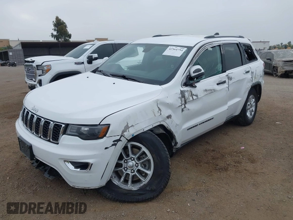 2020 Jeep Grand Cherokee Laredo E with VIN 1C4RJEAG4LC245884, listed as a IAAI auction lot 42564754 with 63,356 mi miles and . Bid and sale history available at DreamBid. Image 6.