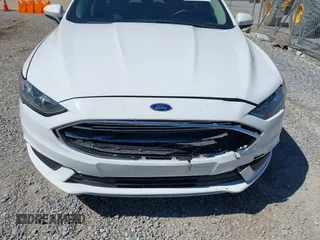 2018 Ford Fusion SE z VIN 3FA6P0H77JR142828, wystawiony jako IAAI lot #41820649 z przebiegiem 208 517 mil mil oraz . Historia ofert i sprzedaży dostępna na DreamBid. Obrazek 6.