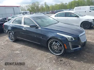 2015 Cadillac CTS Luxury AWD with VIN 1G6AX5SX5F0119102, listed as a IAAI auction lot 42231015 with 106,643 mi miles and . Bid and sale history available at DreamBid. Image 1.
