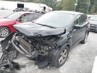 2014 Ford Escape SE with VIN 1FMCU0GX9EUB21853, listed as a IAAI auction lot 40313063 with 106,687 mi miles. Bid and sale history available at carsss.com. Image 2.