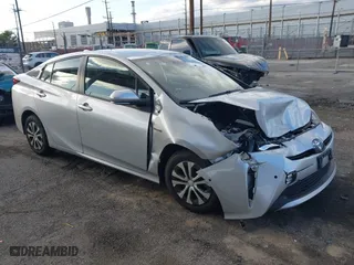 2021 Toyota Prius L Eco with VIN JTDKAMFU0M3143025, listed as a IAAI auction lot 41708848 with 112,465 mi miles. Bid and sale history available at carsss.com. Image 1.