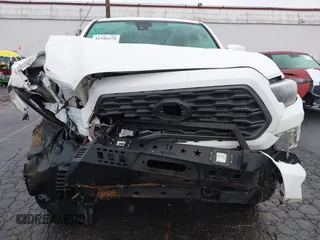 2021 Toyota Tacoma SR5 with VIN 3TMDZ5BN1MM100575, listed as a IAAI auction lot 41516274 with 61,974 mi miles and . Bid and sale history available at DreamBid. Image 6.