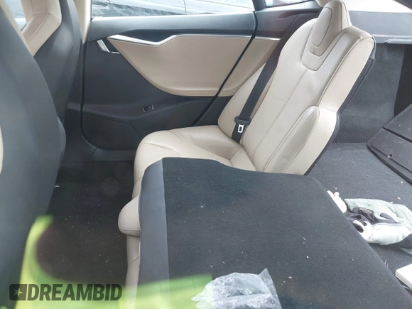 2014 Tesla Model S 60 z VIN 5YJSA1H19EFP51406, wystawiony jako IAAI lot #42179183 z przebiegiem 157 000 mil mil oraz . Historia ofert i sprzedaży dostępna na DreamBid. Obrazek 8.