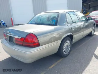 2004 Mercury Grand Marquis GS with VIN 2MEFM74W74X678515, listed as a IAAI auction lot 41916962 with 121,789 mi miles. Bid and sale history available at carsss.com. Image 4.