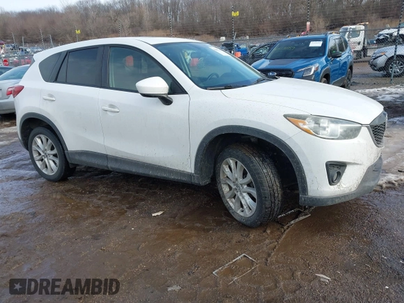 2014 Mazda CX-5 Grand Touring with VIN JM3KE4DY9E0300491, listed as a IAAI auction lot 41657153 with 157,394 mi miles and . Bid and sale history available at DreamBid. Image 1.