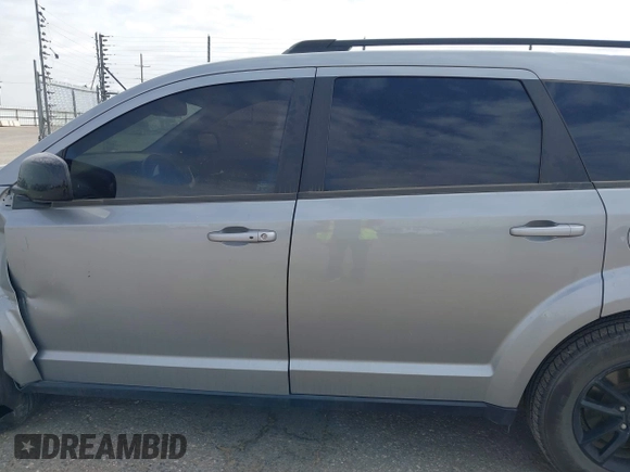 2019 Dodge Journey SE z VIN 3C4PDCBB5KT861358, wystawiony jako IAAI lot #41947841 z przebiegiem 82 099 mil mil oraz . Historia ofert i sprzedaży dostępna na DreamBid. Obrazek 14.