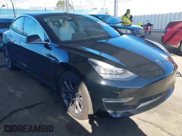 2020 Tesla Model 3 Standard Range Plus with VIN 5YJ3E1EA8LF661982, listed as a IAAI auction lot 41700109 with 30,271 mi miles and . Bid and sale history available at DreamBid. Image 1.