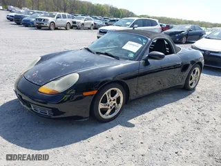 1999 Porsche Boxster with VIN WP0CA2980XU624284, listed as a IAAI auction lot 42058935 with 79,497 mi miles. Bid and sale history available at carsss.com. Image 2.