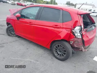 2015 Honda Fit LX with VIN 3HGGK5H5XFM775385, listed as a IAAI auction lot 42555319 with 81,615 mi miles and . Bid and sale history available at DreamBid. Image 3.