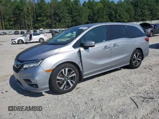2018 Honda Odyssey Elite with VIN 5FNRL6H95JB062033, listed as a Copart auction lot 63732915 with 105,234 mi miles and Salvage title. Bid and sale history available at DreamBid. Image 1.