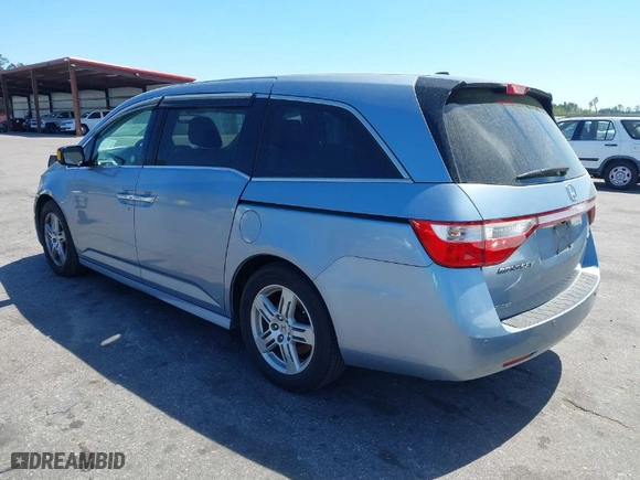 2013 Honda Odyssey Touring with VIN 5FNRL5H94DB069716, listed as a IAAI auction lot 41901369 with 243,492 mi miles. Bid and sale history available at carsss.com. Image 3.