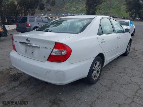 2004 Toyota Camry LE with VIN 4T1BF32K84U065969, listed as a IAAI auction lot 41936434 with 198,886 mi miles. Bid and sale history available at carsss.com. Image 4.