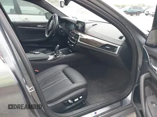 2018 BMW 5 Series M550i xDrive with VIN WBAJB9C55JB035694, listed as a IAAI auction lot 42122730 with 61,561 mi miles and . Bid and sale history available at DreamBid. Image 5.