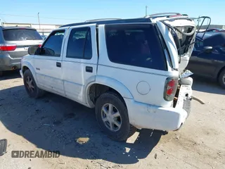 2000 Oldsmobile Bravada z VIN 1GHDT13WXY2284231, wystawiony jako IAAI lot #41751228 z przebiegiem 151 477 mil mil oraz . Historia ofert i sprzedaży dostępna na DreamBid. Obrazek 3.