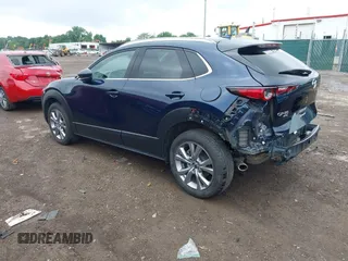 2022 Mazda CX-30 S Premium with VIN 3MVDMBDL0NM413545, listed as a IAAI auction lot 42493594 with 57,013 mi miles and . Bid and sale history available at DreamBid. Image 3.