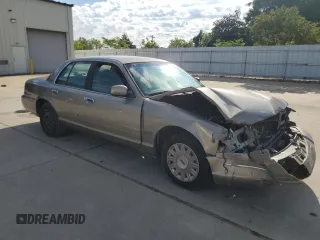 2003 Ford Police Interceptor Street Appear with VIN 2FAFP71W73X148322, listed as a Copart auction lot 55573035 with 268,812 mi miles and Salvage title. Bid and sale history available at DreamBid. Image 4.