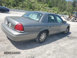 2004 Ford Crown Victoria LX z VIN 2FAFP74W14X130606, wystawiony jako Copart lot #54120085 z przebiegiem 221 700 mil mil oraz Szkody całkowita. Historia ofert i sprzedaży dostępna na DreamBid. Obrazek 3.