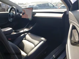 2018 Tesla Model 3 Long Range Battery with VIN 5YJ3E1EA0JF056979, listed as a IAAI auction lot 41865849 with 97,319 mi miles. Bid and sale history available at carsss.com. Image 5.