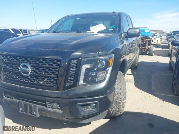 2018 Nissan Titan XD Platinum Reserve with VIN 1N6BA1F44JN522847, listed as a IAAI auction lot 41471499 with 119,124 mi miles. Bid and sale history available at carsss.com. Image 2.
