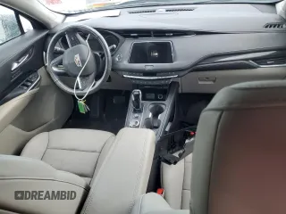2022 Cadillac XT4 FWD Premium Luxury z VIN 1GYFZCR44NF166169, wystawiony jako Copart lot #77981414 z przebiegiem 9 734 mil mil oraz Nie do naprawy • Non repairable. Historia ofert i sprzedaży dostępna na DreamBid. Obrazek 8.