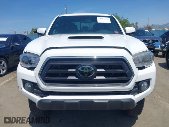 2021 Toyota Tacoma 4WD SR5 with VIN 3TMDZ5BN4MM106693, listed as a IAAI auction lot 41986838 with 52,510 mi miles. Bid and sale history available at carsss.com. Image 12.