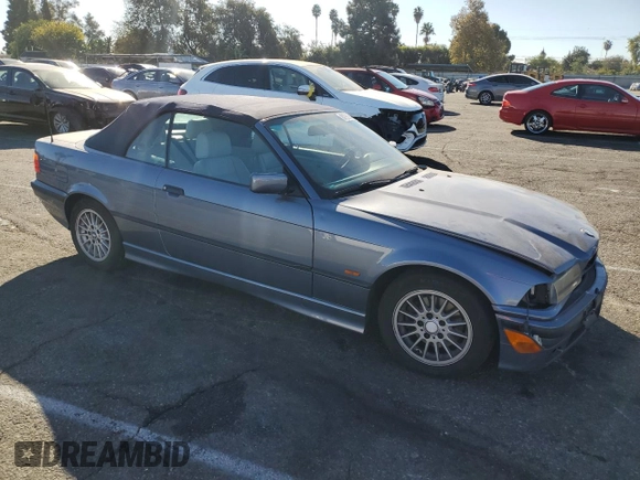 1999 BMW 3 Series 323icA with VIN WBABJ8332XEM24560, listed as a Copart auction lot 80756544 with 63,056 mi miles and Salvage Title. Bid and sale history available at carsss.com. Image 4.