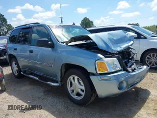 2006 GMC Envoy SLE with VIN 1GKDS13S362310613, listed as a IAAI auction lot 41881880 with 202,893 mi miles. Bid and sale history available at carsss.com. Image 1.