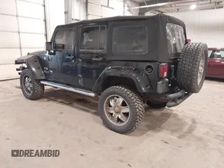 2008 Jeep Wrangler Unlimited X with VIN 1J4GA391X8L558984, listed as a IAAI auction lot 41016498 with 123,308 mi miles. Bid and sale history available at carsss.com. Image 3.