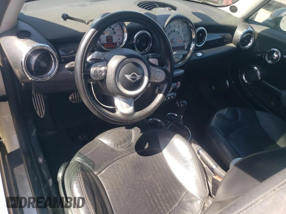 2009 MINI Hardtop S with VIN WMWMF73569TW80561, listed as a Copart auction lot 52615805 with 109,968 mi miles and Salvage title. Bid and sale history available at DreamBid. Image 8.