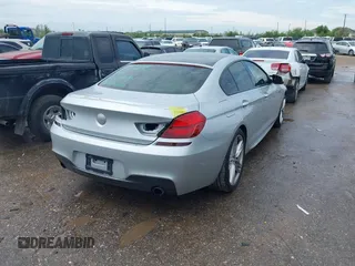 2015 BMW 6 Series 640i z VIN WBA6A0C51FD318982, wystawiony jako IAAI lot #41875547 z przebiegiem 60 968 mil mil oraz . Historia ofert i sprzedaży dostępna na DreamBid. Obrazek 4.