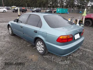 2000 Honda Civic LX with VIN 1HGEJ6677YL000793, listed as a IAAI auction lot 41889317 with 184,766 mi miles. Bid and sale history available at carsss.com. Image 3.