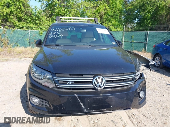 2014 Volkswagen Tiguan S z VIN WVGBV3AX5EW560393, wystawiony jako IAAI lot #42105203 z przebiegiem 102 001 mil mil oraz . Historia ofert i sprzedaży dostępna na DreamBid. Obrazek 13.