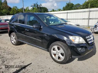 2011 Mercedes-Benz M 350 with VIN 4JGBB2FB5BA744077, listed as a Copart auction lot 61565615 with 125,813 mi miles and Salvage title. Bid and sale history available at DreamBid. Image 4.