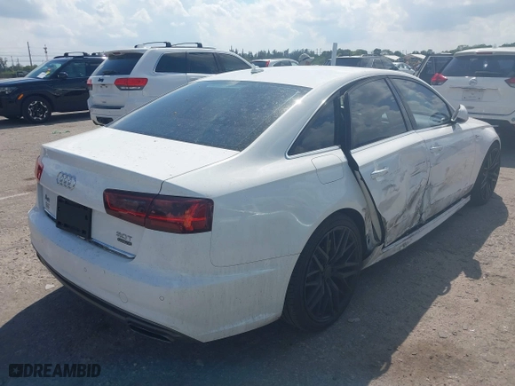 2016 Audi A6 3.0T Premium Plus with VIN WAUFGAFC9GN003664, listed as a IAAI auction lot 41890962 with 100,485 mi miles. Bid and sale history available at carsss.com. Image 4.