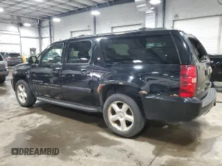 2009 Chevrolet Suburban LT w/2LT with VIN 1GNFK26319J124911, listed as a Copart auction lot 53263455 with 215,826 mi miles and Salvage Title. Bid and sale history available at carsss.com. Image 2.