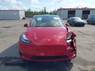 2023 Tesla Model Y Long Range with VIN 7SAYGDEE1PA154996, listed as a IAAI auction lot 41472595 with 24,861 mi miles and . Bid and sale history available at DreamBid. Image 12.