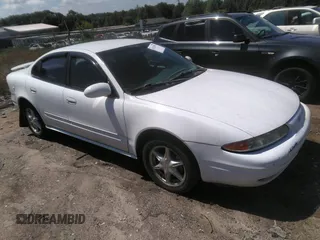 2000 Oldsmobile Alero GL2 z VIN 1G3NL52E4YC403539, wystawiony jako IAAI lot #42313033 z przebiegiem Nie podano mil oraz . Historia ofert i sprzedaży dostępna na DreamBid. Obrazek 1.
