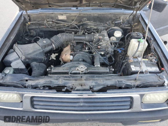 1994 Mitsubishi Mighty Max z VIN JA7LS21G6RP012556, wystawiony jako Copart lot #44242825 z przebiegiem 213 338 mil mil oraz Szkoda całkowita • Salvage title. Historia ofert i sprzedaży dostępna na DreamBid. Obrazek 11.