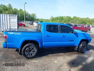 2021 Toyota Tacoma SR z VIN 3TYCZ5AN7MT008274, wystawiony jako IAAI lot #42091508 z przebiegiem 59 371 mil mil oraz . Historia ofert i sprzedaży dostępna na DreamBid. Obrazek 14.