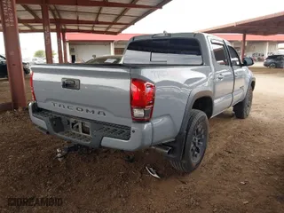 2019 Toyota Tacoma 4WD SR with VIN 3TMCZ5ANXKM225066, listed as a IAAI auction lot 41825265 with 75,908 mi miles. Bid and sale history available at carsss.com. Image 4.